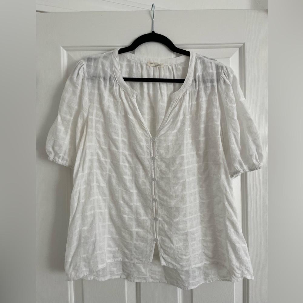 Trendy casual blouse. White cotton blend. Subtle pattern with cute button front.